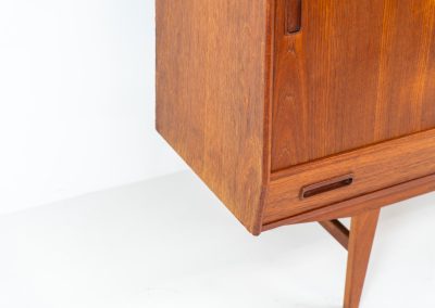 Teak highboard by P. Westergaard (Denmark, 1960s). This beautiful highboard comes with four sliding Doors and two wide drawers. It has beautiful teak wood patterns, nice inset handels and tons of storage space on the inside. Its in very good vintage condition with a few repair marks and small age related using traces. Labeled by maker.