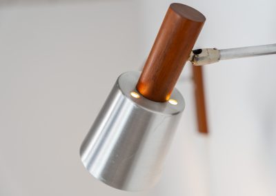 Stunning pair of Mid-century “Silva” wall lights by Lyfa (Denmark, 1960s). Each fixture features a solid teak base and cone, a sleek stainless steel adjustable arm, and a beautifully brushed aluminum lampshade. The combination of warm wood tones and cool metallic accents gives these lights a refined yet contemporary aesthetic. Both pieces are in very good condition, with only minor surface scratches on the shades. A true statement piece for any interior.