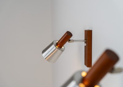 Stunning pair of Mid-century “Silva” wall lights by Lyfa (Denmark, 1960s). Each fixture features a solid teak base and cone, a sleek stainless steel adjustable arm, and a beautifully brushed aluminum lampshade. The combination of warm wood tones and cool metallic accents gives these lights a refined yet contemporary aesthetic. Both pieces are in very good condition, with only minor surface scratches on the shades. A true statement piece for any interior.