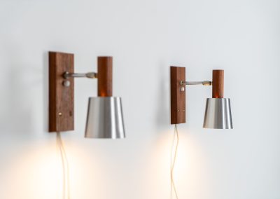 Stunning pair of Mid-century “Silva” wall lights by Lyfa (Denmark, 1960s). Each fixture features a solid teak base and cone, a sleek stainless steel adjustable arm, and a beautifully brushed aluminum lampshade. The combination of warm wood tones and cool metallic accents gives these lights a refined yet contemporary aesthetic. Both pieces are in very good condition, with only minor surface scratches on the shades. A true statement piece for any interior.