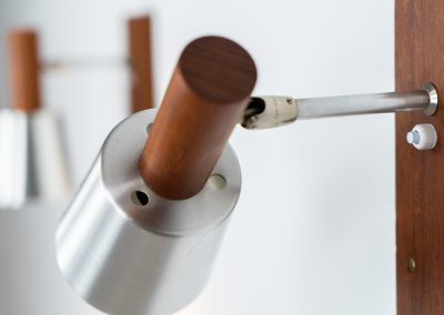 Stunning pair of Mid-century “Silva” wall lights by Lyfa (Denmark, 1960s). Each fixture features a solid teak base and cone, a sleek stainless steel adjustable arm, and a beautifully brushed aluminum lampshade. The combination of warm wood tones and cool metallic accents gives these lights a refined yet contemporary aesthetic. Both pieces are in very good condition, with only minor surface scratches on the shades. A true statement piece for any interior.