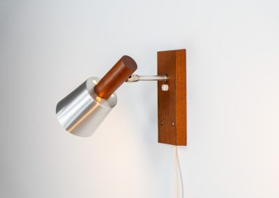 Stunning pair of Mid-century “Silva” wall lights by Lyfa (Denmark, 1960s). Each fixture features a solid teak base and cone, a sleek stainless steel adjustable arm, and a beautifully brushed aluminum lampshade. The combination of warm wood tones and cool metallic accents gives these lights a refined yet contemporary aesthetic. Both pieces are in very good condition, with only minor surface scratches on the shades. A true statement piece for any interior.