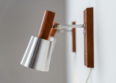 Stunning pair of Mid-century “Silva” wall lights by Lyfa (Denmark, 1960s). Each fixture features a solid teak base and cone, a sleek stainless steel adjustable arm, and a beautifully brushed aluminum lampshade. The combination of warm wood tones and cool metallic accents gives these lights a refined yet contemporary aesthetic. Both pieces are in very good condition, with only minor surface scratches on the shades. A true statement piece for any interior.