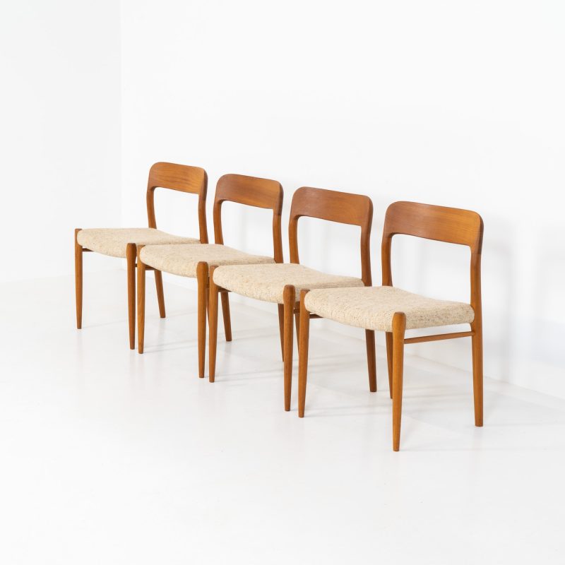 Set of 4 “Model 75” dining chairs by Niels Otto Møller for J.L. Møller (Denmark, 1960s). These iconic chairs are made out of a solid teak frame and upholstered in the original beige wool fabric. The combination of the sculptural and organic shapes combined with the natural woodgrain and the contrasting fabric makes this one hell of a chair! In very good condition and labeled by maker.