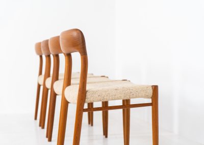 Set of 4 “Model 75” dining chairs by Niels Otto Møller for J.L. Møller (Denmark, 1960s). These iconic chairs are made out of a solid teak frame and upholstered in the original beige wool fabric. The combination of the sculptural and organic shapes combined with the natural woodgrain and the contrasting fabric makes this one hell of a chair! In very good condition and labeled by maker.