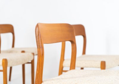 Set of 4 “Model 75” dining chairs by Niels Otto Møller for J.L. Møller (Denmark, 1960s). These iconic chairs are made out of a solid teak frame and upholstered in the original beige wool fabric. The combination of the sculptural and organic shapes combined with the natural woodgrain and the contrasting fabric makes this one hell of a chair! In very good condition and labeled by maker.