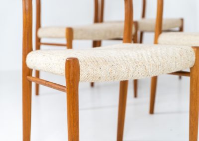 Set of 4 “Model 75” dining chairs by Niels Otto Møller for J.L. Møller (Denmark, 1960s). These iconic chairs are made out of a solid teak frame and upholstered in the original beige wool fabric. The combination of the sculptural and organic shapes combined with the natural woodgrain and the contrasting fabric makes this one hell of a chair! In very good condition and labeled by maker.