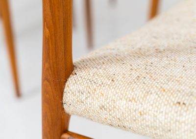 Set of 4 “Model 75” dining chairs by Niels Otto Møller for J.L. Møller (Denmark, 1960s). These iconic chairs are made out of a solid teak frame and upholstered in the original beige wool fabric. The combination of the sculptural and organic shapes combined with the natural woodgrain and the contrasting fabric makes this one hell of a chair! In very good condition and labeled by maker.