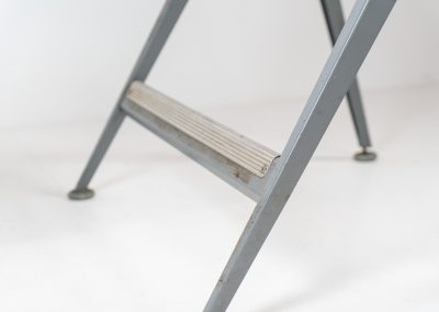 “Reply” drafting table and chair by Wim Rietveld & Friso Kramer for Ahrend de Cirkel (The Netherlands, 1950s). This highly adjustable collaboration by Friso Kramer & Wim Rietveld makes it possible to use the table at any preferred height and position. It won the prestigious ‘Singe d’Or’ in Brussels 1963. It consists of an enameled metal frame and a wooden top which both have a nice patina and age related using traces. A perfect piece to use as a writing desk or architect table. The table and chair are both marked by maker.