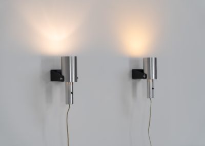Beautiful pair of “Sonet” wall lights by Hans P. Jeppesen for Fog & Mørup (Denmark, 1960s). These modernist fixtures feature a black lacquered metal base and a brushed aluminium lamp shade, they are easily adjustable in multiple angles and directions. Both pieces are in original condition. They do have a few dents and surface scratches, but are in very good vintage condition! Labeled by maker.