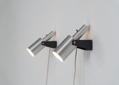 Beautiful pair of “Sonet” wall lights by Hans P. Jeppesen for Fog & Mørup (Denmark, 1960s). These modernist fixtures feature a black lacquered metal base and a brushed aluminium lamp shade, they are easily adjustable in multiple angles and directions. Both pieces are in original condition. They do have a few dents and surface scratches, but are in very good vintage condition! Labeled by maker.