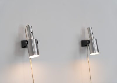 Beautiful pair of “Sonet” wall lights by Hans P. Jeppesen for Fog & Mørup (Denmark, 1960s). These modernist fixtures feature a black lacquered metal base and a brushed aluminium lamp shade, they are easily adjustable in multiple angles and directions. Both pieces are in original condition. They do have a few dents and surface scratches, but are in very good vintage condition! Labeled by maker.