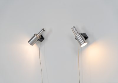 Beautiful pair of “Sonet” wall lights by Hans P. Jeppesen for Fog & Mørup (Denmark, 1960s). These modernist fixtures feature a black lacquered metal base and a brushed aluminium lamp shade, they are easily adjustable in multiple angles and directions. Both pieces are in original condition. They do have a few dents and surface scratches, but are in very good vintage condition! Labeled by maker.