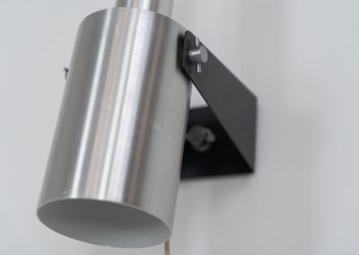 Beautiful pair of “Sonet” wall lights by Hans P. Jeppesen for Fog & Mørup (Denmark, 1960s). These modernist fixtures feature a black lacquered metal base and a brushed aluminium lamp shade, they are easily adjustable in multiple angles and directions. Both pieces are in original condition. They do have a few dents and surface scratches, but are in very good vintage condition! Labeled by maker.