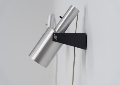 Beautiful pair of “Sonet” wall lights by Hans P. Jeppesen for Fog & Mørup (Denmark, 1960s). These modernist fixtures feature a black lacquered metal base and a brushed aluminium lamp shade, they are easily adjustable in multiple angles and directions. Both pieces are in original condition. They do have a few dents and surface scratches, but are in very good vintage condition! Labeled by maker.