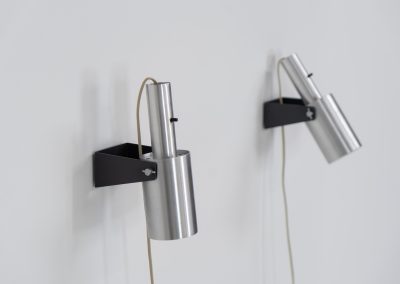Beautiful pair of “Sonet” wall lights by Hans P. Jeppesen for Fog & Mørup (Denmark, 1960s). These modernist fixtures feature a black lacquered metal base and a brushed aluminium lamp shade, they are easily adjustable in multiple angles and directions. Both pieces are in original condition. They do have a few dents and surface scratches, but are in very good vintage condition! Labeled by maker.