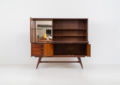 Cupboard by Louis van Teeffelen for Wébé (the Netherlands, 1960s). A typical van Teeffelen design with nicely sculpted details and organic forms. It features three drawers, an open shelve and four doors with lots of storage space on the inside. In very good condition with some visible using traces.