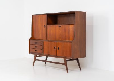 Cupboard by Louis van Teeffelen for Wébé (the Netherlands, 1960s). A typical van Teeffelen design with nicely sculpted details and organic forms. It features three drawers, an open shelve and four doors with lots of storage space on the inside. In very good condition with some visible using traces.