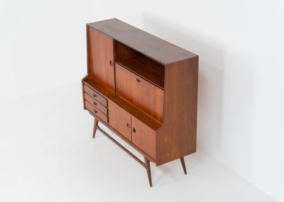 Cupboard by Louis van Teeffelen for Wébé (the Netherlands, 1960s). A typical van Teeffelen design with nicely sculpted details and organic forms. It features three drawers, an open shelve and four doors with lots of storage space on the inside. In very good condition with some visible using traces.