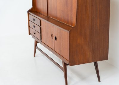 Cupboard by Louis van Teeffelen for Wébé (the Netherlands, 1960s). A typical van Teeffelen design with nicely sculpted details and organic forms. It features three drawers, an open shelve and four doors with lots of storage space on the inside. In very good condition with some visible using traces.