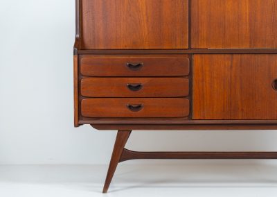 Cupboard by Louis van Teeffelen for Wébé (the Netherlands, 1960s). A typical van Teeffelen design with nicely sculpted details and organic forms. It features three drawers, an open shelve and four doors with lots of storage space on the inside. In very good condition with some visible using traces.