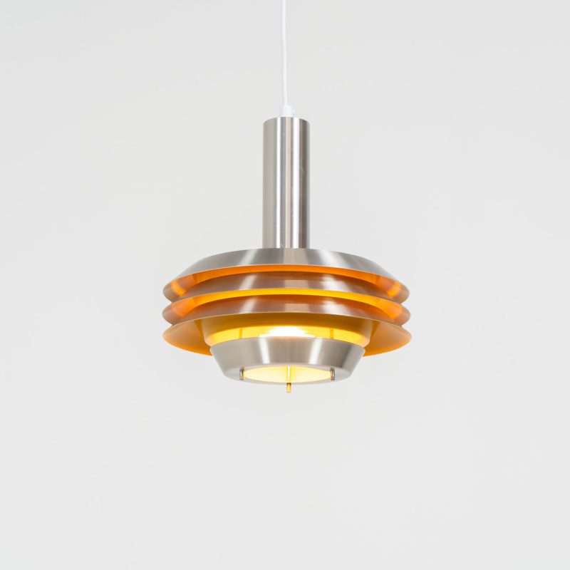 Stunning pendant light by Lyskaer Belysning (Denmark, 1970s). An amazing design crafted out of four brushed aluminium shades. The inside is lacquered in yellow which gives a beautiful effect when the light is turned on, and a colorful touch when it is turned off. The lamp is in great condition and newly rewired.