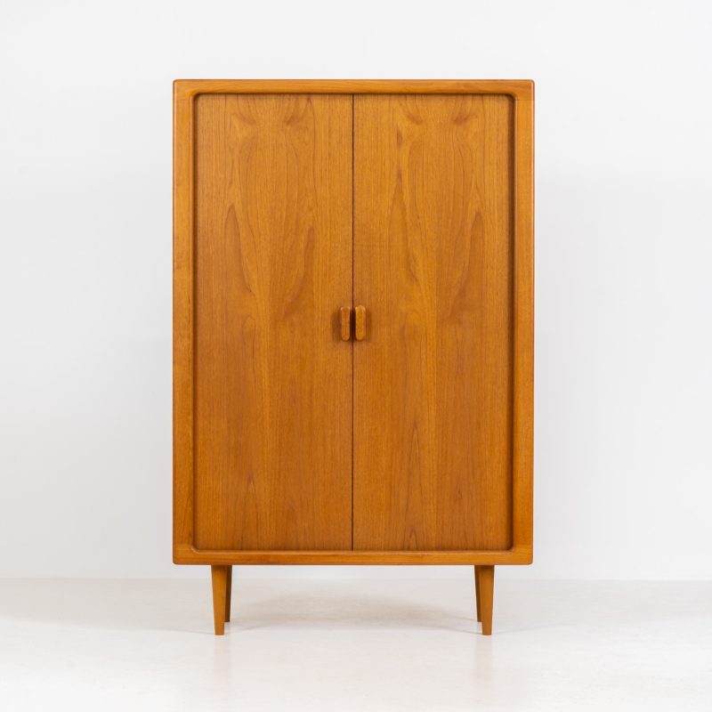 Wonderful highboard/bookcase with tambour doors by CFC Silkeborg (Denmark, 1960s). The highboard is made out of teak and features stunning organic shapes and lots of amazing details, like the two tambour doors and the rounded handles. The shelves on the inside are adjustable. This piece presents itself in mint condition with no damages or significant using traces.
