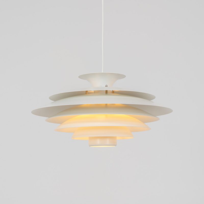 Beautiful “52580” pendant light by Form Light (Denmark, 1970s). We found this large beauty still packed & sealed in the original box, it has been stored for more than 50 years! Other than a little corrosion on the bolts due to the age, it is in unused and perfect condition. We’ve replaced the original socket and extendable cable because we prefer a normal cable, but we provide both. The lamp is crafted out of seven metal shades and gives a stunning light dispersion. Labeled by maker.