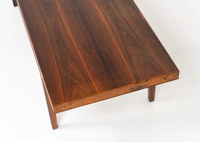 Large Rosewood coffee table by Severin Hansen for Haslev Møbelfabrik (Denmark, 1960s). A beautifully crafted coffee table made from rich rosewood, showcasing a stunning wood grain and an elegant, minimalist design. The seamless joinery between the tabletop and legs is a testament to exceptional craftsmanship and a signature technique of Severin Hansen. A timeless piece that embodies Danish modern design at its finest. It is in very good condition!
