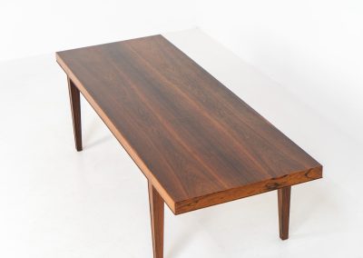 Large Rosewood coffee table by Severin Hansen for Haslev Møbelfabrik (Denmark, 1960s). A beautifully crafted coffee table made from rich rosewood, showcasing a stunning wood grain and an elegant, minimalist design. The seamless joinery between the tabletop and legs is a testament to exceptional craftsmanship and a signature technique of Severin Hansen. A timeless piece that embodies Danish modern design at its finest. It is in very good condition!