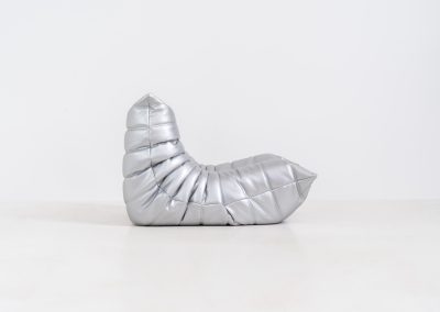 “Metallic Silver” Limited edition Togo 1 seater by Michel Ducaroy for Ligne Roset (France, 2017). This is not your average Togo! A true statement piece, made to stand out. This limited edition in the striking “Metallic Silver” finish was produced in 2017 and comes dated and labeled. It is in very good condition, with only a few minor surface scratches. A rare find for collectors and enthusiasts.