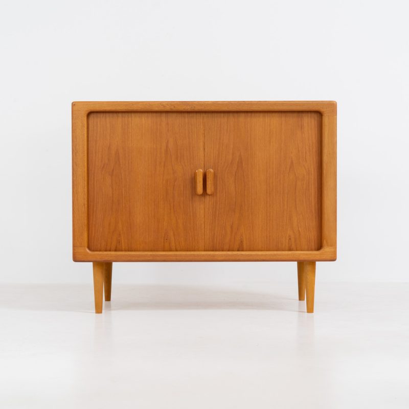 Wonderful cabinet with tambour doors by CFC Silkeborg (Denmark, 1960s). The cabinet is made out of teak and features stunning organic shapes and lots of amazing details, like the two tambour doors and the rounded handles. The shelve on the inside is adjustable. A perfect piece to use for a record player and vinyls! This piece presents itself in very condition with no damages, the top has a little discoloration.