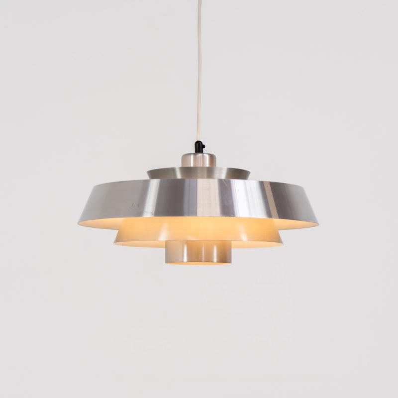 “Nova” pendant light by Jo Hammerborg for Fog & Mørup (Denmark, 1960s). A wonderful Danish modern design classic by Jo Hammerborg, the Nova pendant features four layered brushed aluminium shades that create a warm, diffused light effect. This piece is in original and good vintage condition, showing some surface scratches and light corrosion consistent with age.