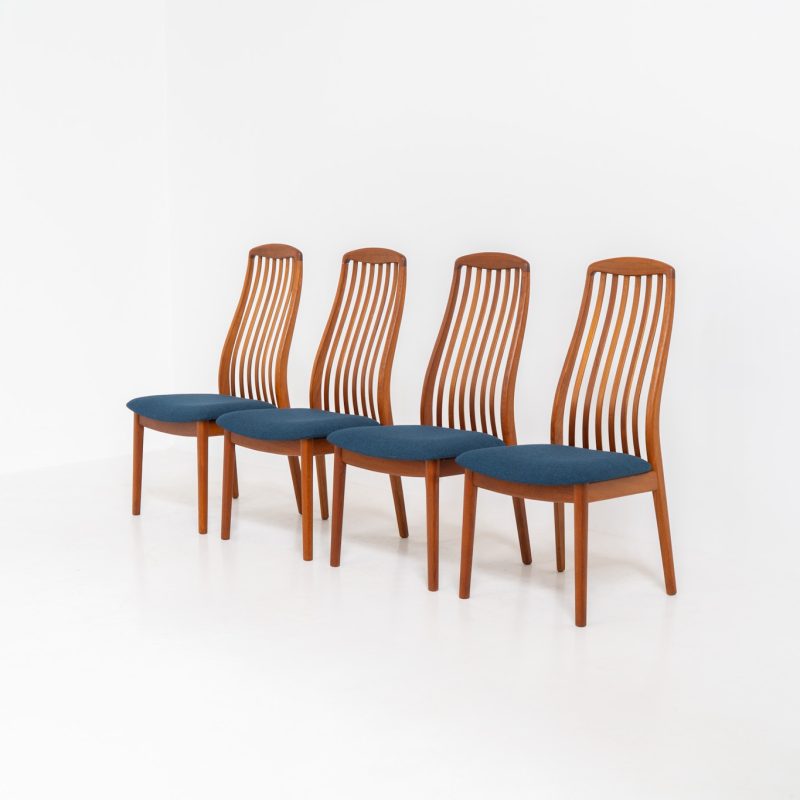 Set of 4 dining chairs by Kai Kristiansen for Schou Andersen (Denmark, 1950s). A stunning set of mid-century dining chairs, crafted with solid teak frames and featuring organically sculpted backrests. The seats are newly upholstered in a beautiful deep blue fabric. The set of chairs presents itself in splendid condition.