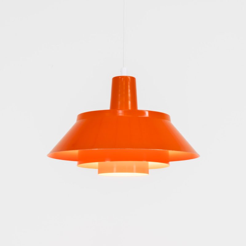Colorful Danish pentant light, 1960s A beautiful lamp made out of aluminum shades lacquered in a stunning orange. We don’t know who made this one but it reminds us to Jo Hammerborg and Jørn Utzon. The lamp features its original lacquer and is in very condition. It is newly rewired.