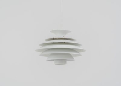 Pendant light by Jeka Metaltryk (Denmark, 1970s). A striking pendant light featuring a dynamic, sculptural form crafted from seven layered steel shades. The design softly diffuses light, creating a warm and calming glow. The lamp has been newly rewired and is in excellent condition.