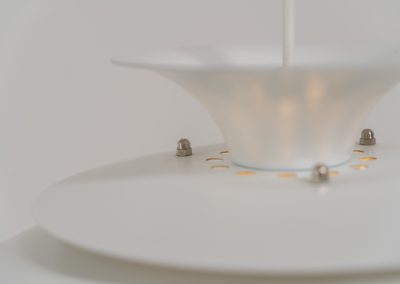 Pendant light by Jeka Metaltryk (Denmark, 1970s). A striking pendant light featuring a dynamic, sculptural form crafted from seven layered steel shades. The design softly diffuses light, creating a warm and calming glow. The lamp has been newly rewired and is in excellent condition.