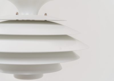 Pendant light by Jeka Metaltryk (Denmark, 1970s). A striking pendant light featuring a dynamic, sculptural form crafted from seven layered steel shades. The design softly diffuses light, creating a warm and calming glow. The lamp has been newly rewired and is in excellent condition.