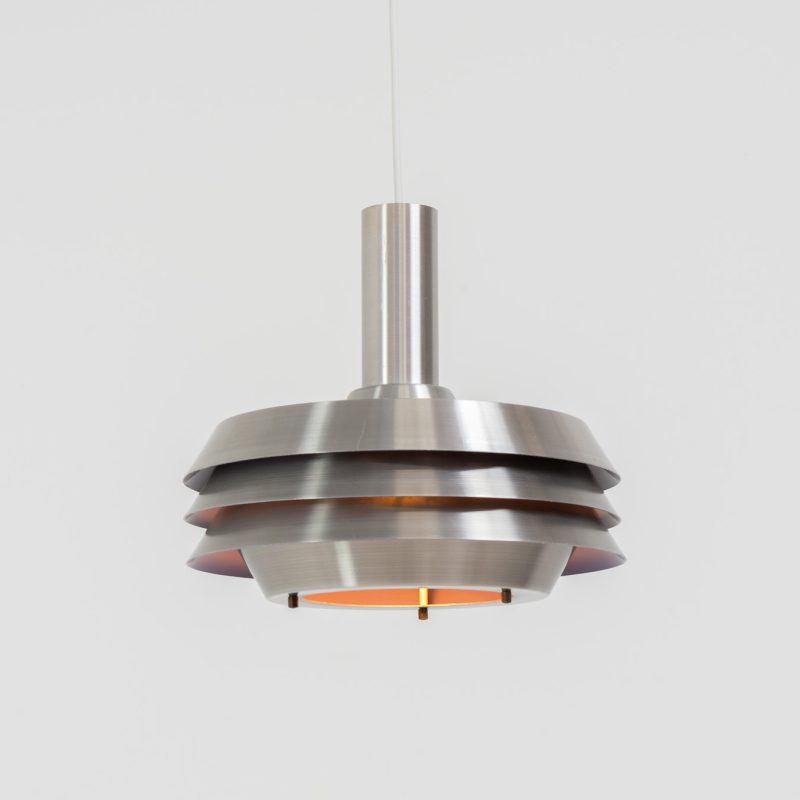 Beautiful pendant light by Lyskaer Belysning (Denmark, 1970s). An amazing design crafted out of four brushed aluminium shades. The inside is lacquered in purple which gives a beautiful effect when the light is turned on, and a colorful touch when it is turned off. The lamp is in very good condition and newly rewired.