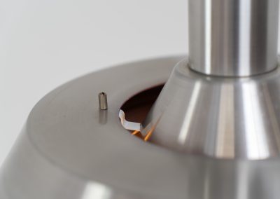 Beautiful pendant light by Lyskaer Belysning (Denmark, 1970s). An amazing design crafted out of four brushed aluminium shades. The inside is lacquered in purple which gives a beautiful effect when the light is turned on, and a colorful touch when it is turned off. The lamp is in very good condition and newly rewired.