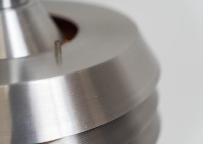 Beautiful pendant light by Lyskaer Belysning (Denmark, 1970s). An amazing design crafted out of four brushed aluminium shades. The inside is lacquered in purple which gives a beautiful effect when the light is turned on, and a colorful touch when it is turned off. The lamp is in very good condition and newly rewired.