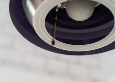 Beautiful pendant light by Lyskaer Belysning (Denmark, 1970s). An amazing design crafted out of four brushed aluminium shades. The inside is lacquered in purple which gives a beautiful effect when the light is turned on, and a colorful touch when it is turned off. The lamp is in very good condition and newly rewired.