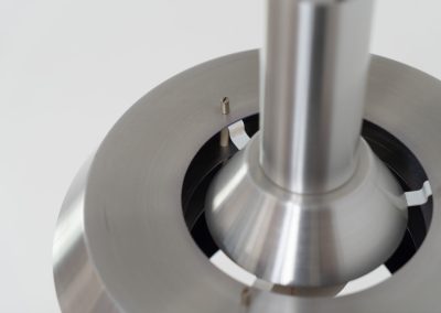 Beautiful pendant light by Lyskaer Belysning (Denmark, 1970s). An amazing design crafted out of four brushed aluminium shades. The inside is lacquered in purple which gives a beautiful effect when the light is turned on, and a colorful touch when it is turned off. The lamp is in very good condition and newly rewired.