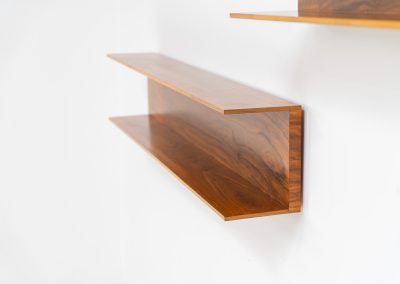 Set of 2 huge wall shelves by Walter Wirz for Wilhelm Renz (Germany, 1965). These iconic U-shaped wall shelves in teak are just stunning. They are sleek, timeless and absolutely beautiful. The shelves remain in very good and original condition. They are labeled.