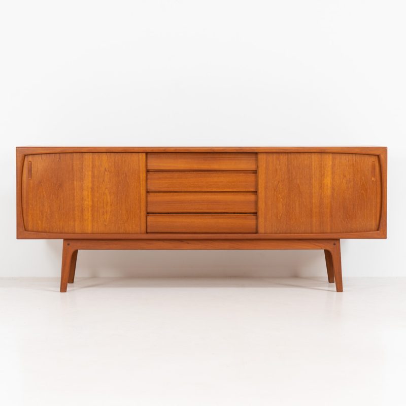 Stunning Danish sideboard in teak, 1960s. This piece is absolutely gorgeous! While the designer remains unknown, it is extremely detailed and built to very high quality standards. It features two sliding doors and four drawers. The rounded edges, organic shapes and clean inset handles on this piece are just amazing. The backside is nicely finished so it can perfectly be placed in the center of a space. In excellent condition!
