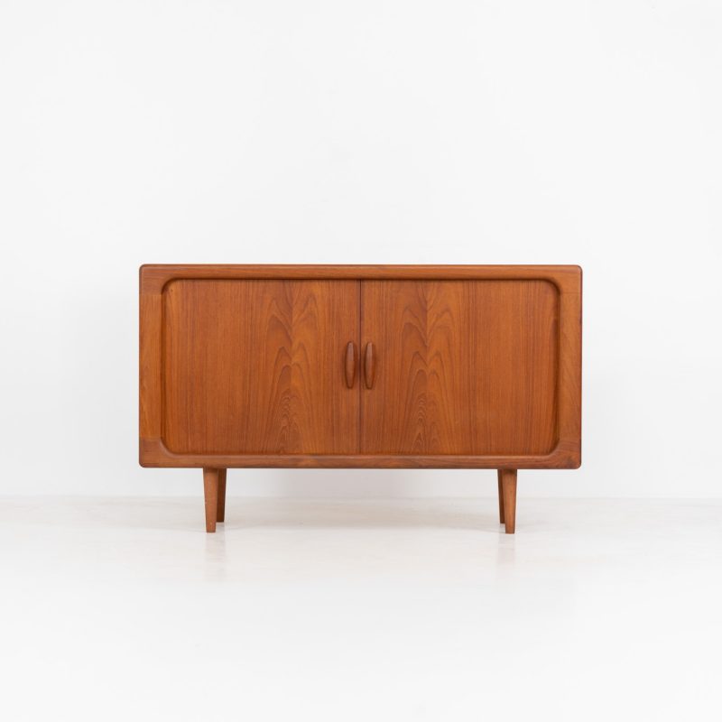 Svend Dyrlund teak sideboard with tambour doors (Denmark, 1960s). A fabulous sideboard that perfectly combines nice organic shapes and loads of detail, like the tambour sliding doors and the beautiful handles. It offers lots of storage space an adjustable shelve on the inside. In splendid condition! Labeled by maker.
