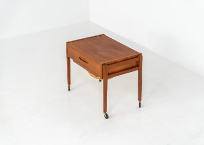 Teak sewing trolley / side table on castors (Denmark, 1960s). This little beauty features a drawer and a wicker basket that can be slid out. It’s in good condition.