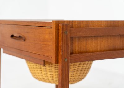Teak sewing trolley / side table on castors (Denmark, 1960s). This little beauty features a drawer and a wicker basket that can be slid out. It’s in good condition.