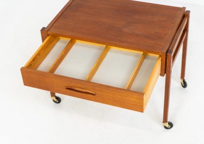 Teak sewing trolley / side table on castors (Denmark, 1960s). This little beauty features a drawer and a wicker basket that can be slid out. It’s in good condition.