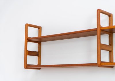 Stunning wall-shelve by Svend Dyrlund (Denmark, 1960s). This elegant wall-shelve, crafted in teak, features nice organic edges and provides the perfect combination of functionality and aesthetics. It is in splendid condition!